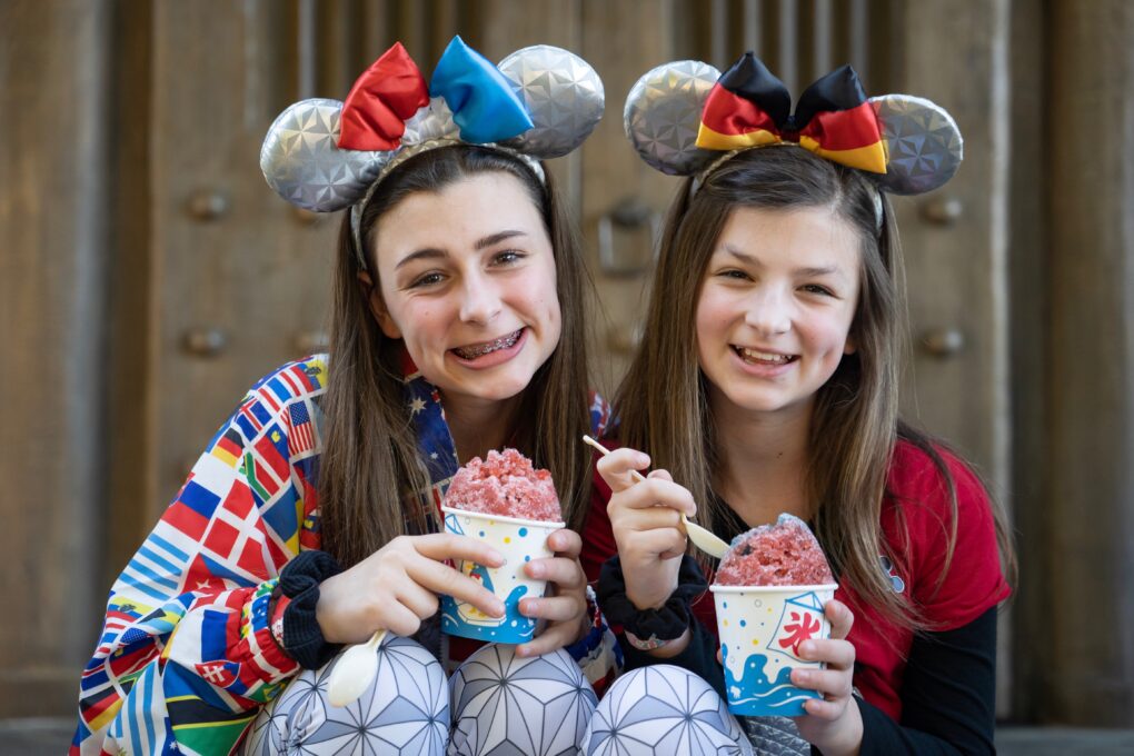 Sisters enjoy Kakigōri shaved ice treats in the Japan Pavilion of Epcot World Showcase -- this ultimate guide to all the top sweet treats, savory snacks and best beverages you can find in Epcot’s World Showcase just for you.