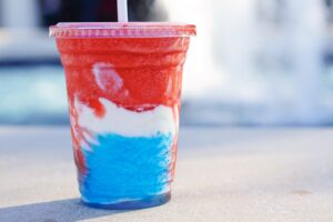 American Dream Slush from the Fife and Drum Tavern at Epcot World Showcase. A patriotic-colored mixture of strawberry and blue raspberry Fanta slushies and vanilla soft-serve.