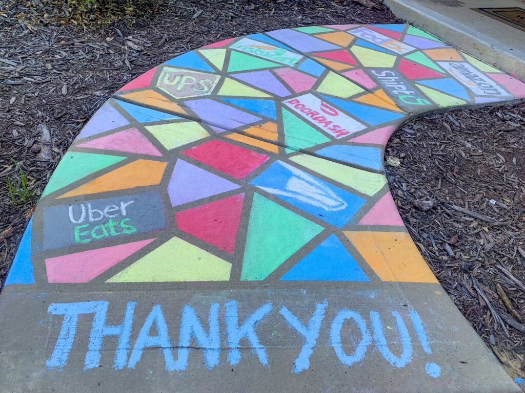 Chalk thank you sign on sidewalk. Use your driveway or sidewalk as a canvas. With so many people walking these days this is a great opportunity to spread good cheer and gratitude with hopeful messages of encouragement and thanks. 