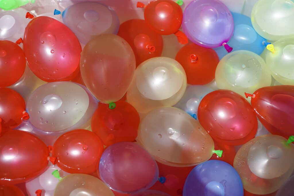 Colorful waterballoons filled and ready to use. Send the kids outside to battle it out and get soaked or join in on the fun. Filling balloons has never been easier! We use "Bunch O Balloons" to fill several up at once using our garden hose. If you want to make it really competitive set up some bases to hide behind. 