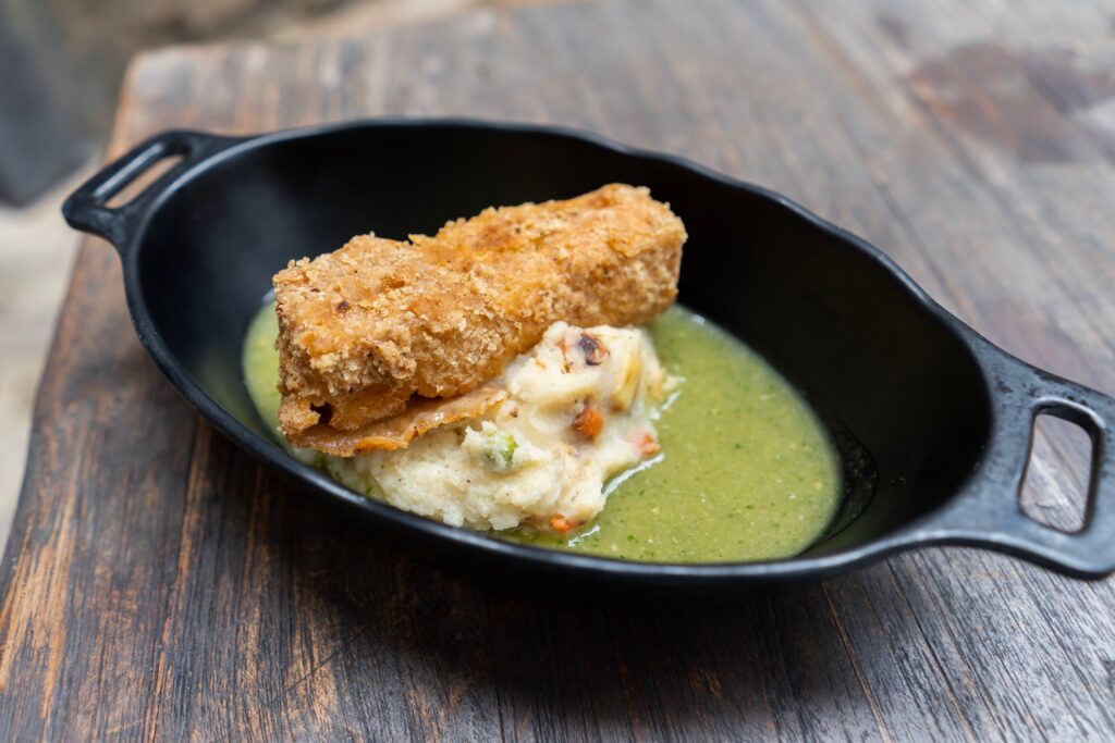 Fried Endorian Tip-yip – rectangular-shaped crispy chicken served with roasted vegetable potato mash and herb gravy.