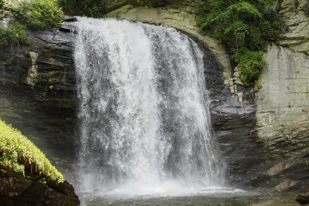 Photo of Looking Glass Falls in North Carolina.Go online to research waterfalls in your region. Plan a day trip and bring along a picnic with plenty of water for hydration. Just make sure to put safety first — getting the perfect picture isn’t worth an accident. 