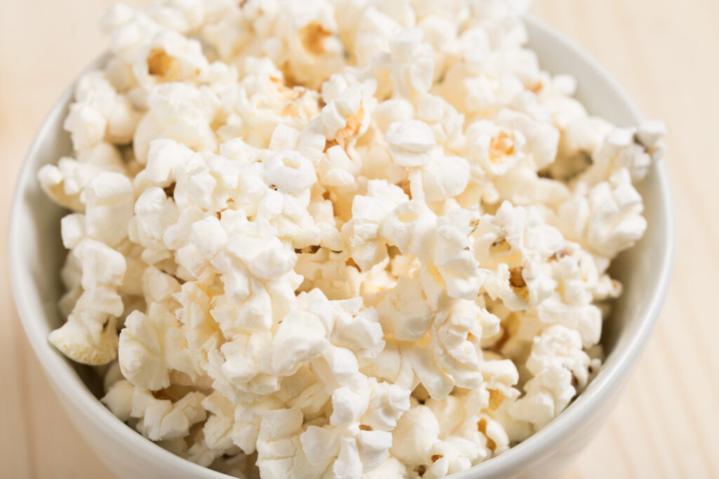 Bowl of popcorn. See a Broadway show from home this summer. - Safe Summer Bucket List – 100 Ways to Have Fun This Summer While Social Distancing