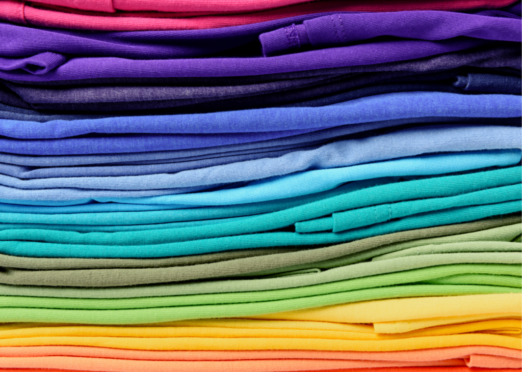 Colorful pile of folded clothing. It’s the perfect time to organize the garage, declutter the attic, sort through daunting piles of paperwork or just go through those junk drawers. Donate any unwanted items to a local charity drop off site. 