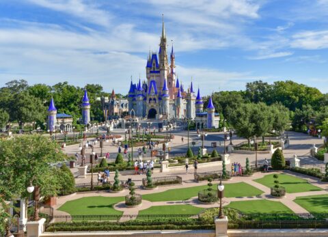 View of Cinderella Castle at the Magic Kingdom with its new pink paint job. Light crowds in front of the castle demonstrate Dinsey's limited capacity restrictions in place during the Coronavirus Pandemic.